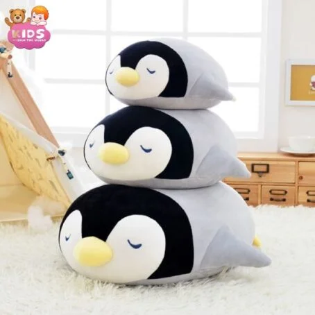 Pingouin en peluche endormi