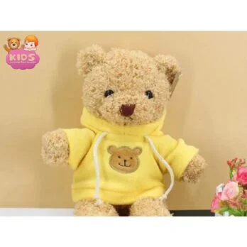Ours En Peluche Jaune Avec Un Pull.